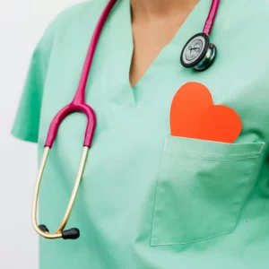 Healthcare professional in scrubs with a stethoscope